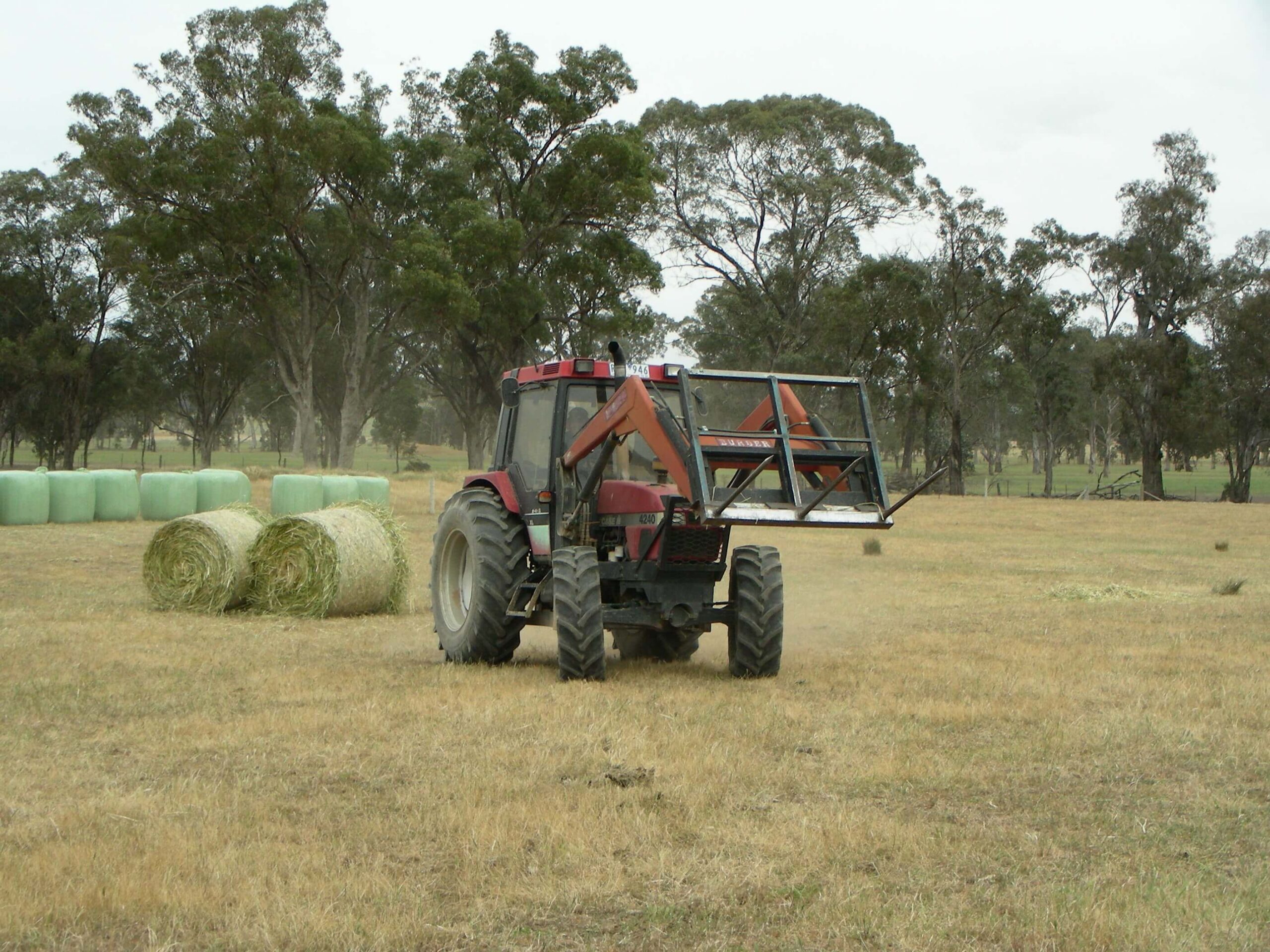 Tractor moving hay and silage - agricultural copywriter, Crystal Lobban.